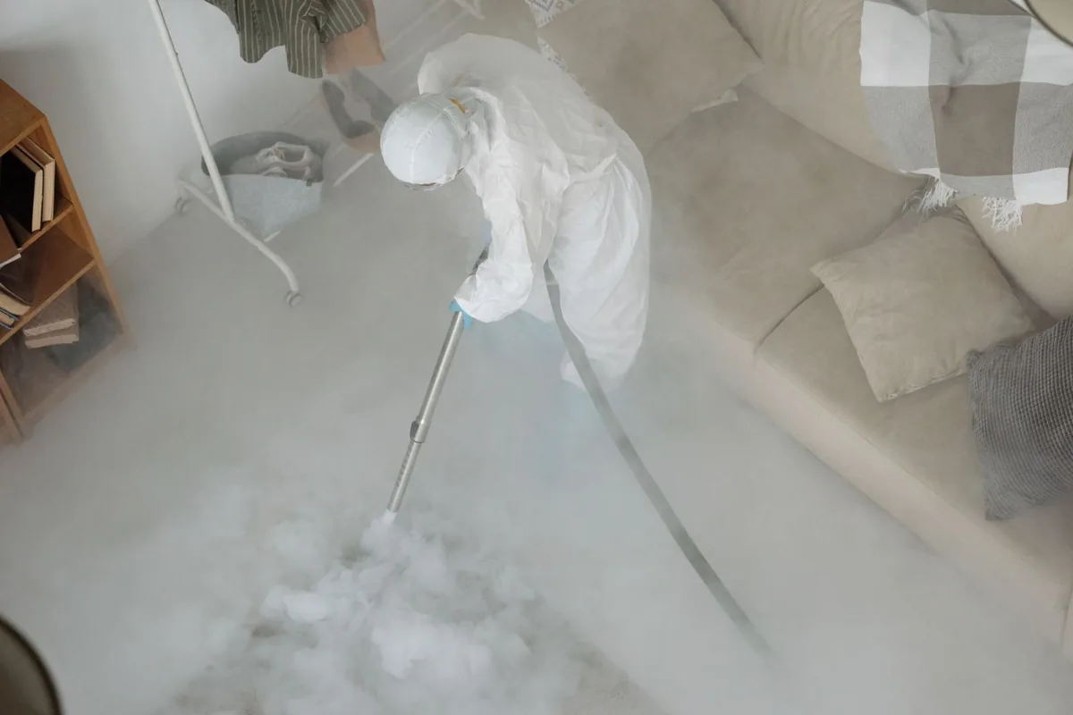 Biohazard cleanup technician in protective equipment, Escalon, CA